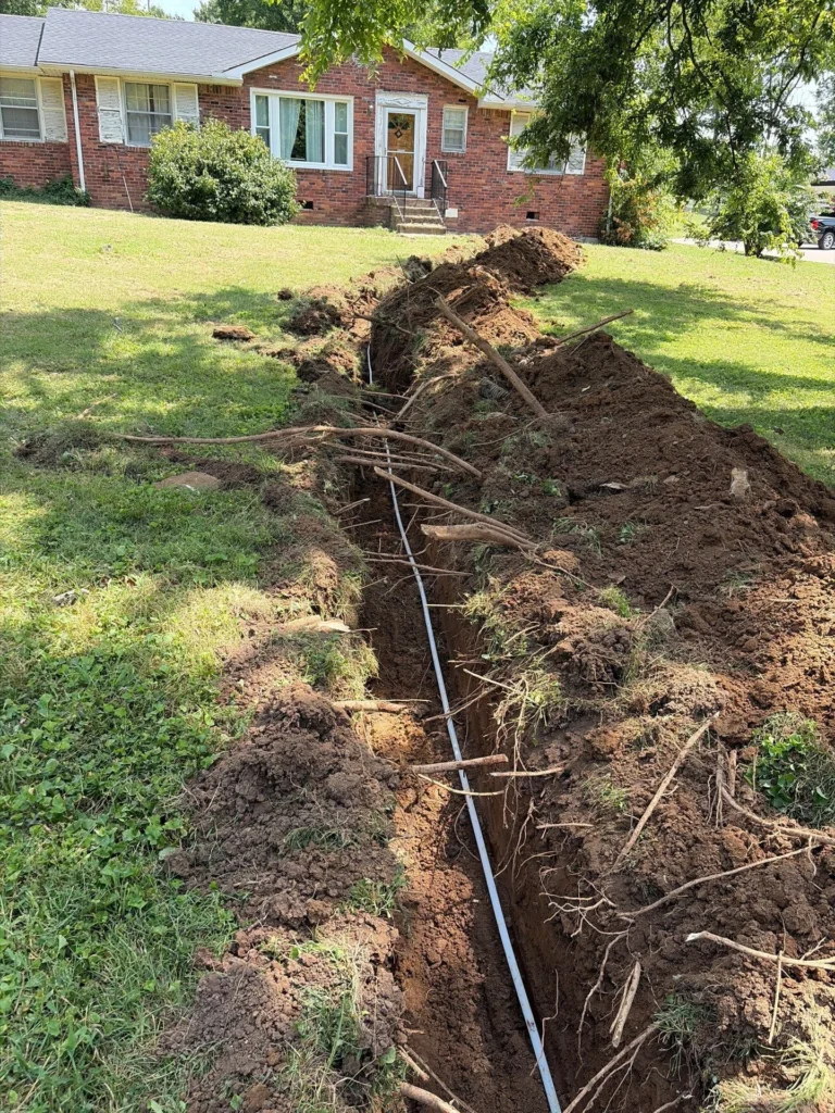 Galvanized water main replaced across a Madison yard