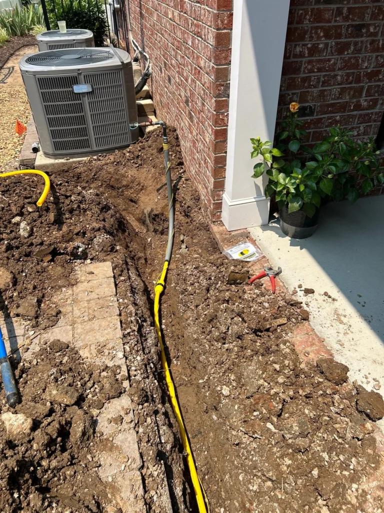 Trench opened alongside a Bellevue home for a new gas line