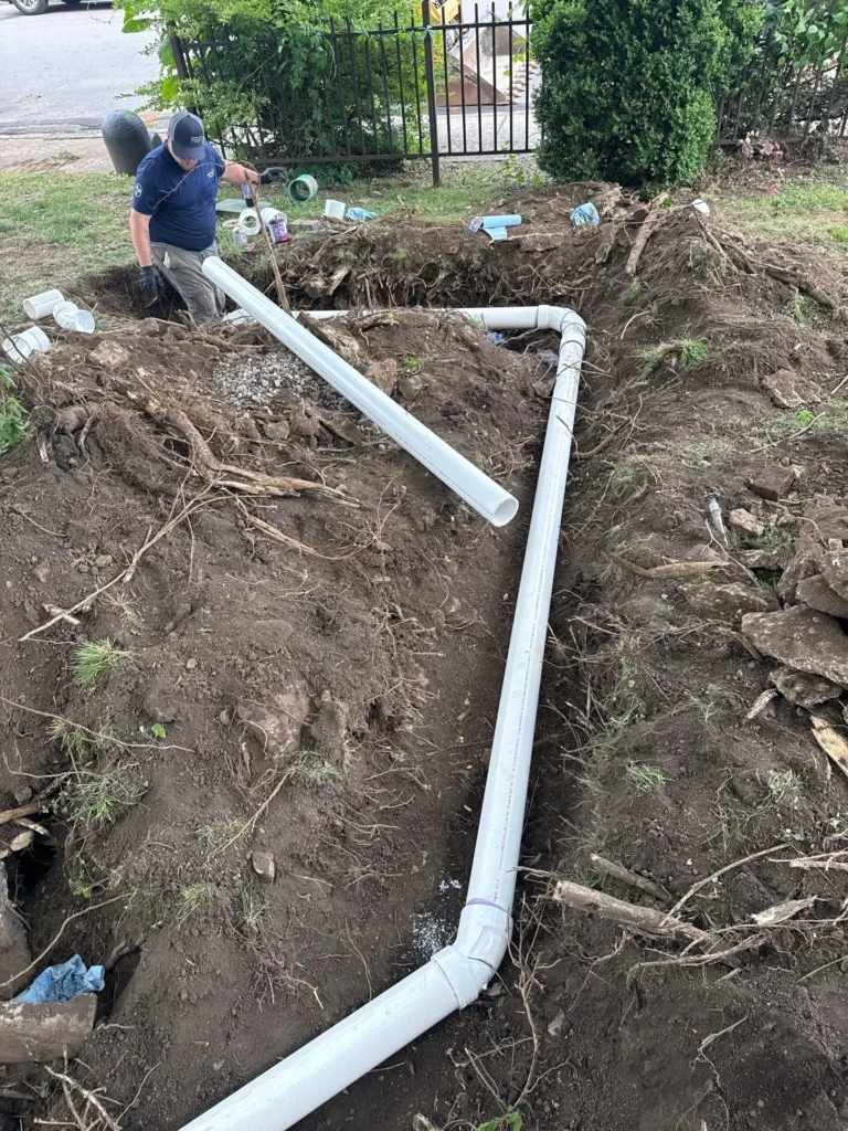 Cast iron sewer line repair underway in a West Nashville yard