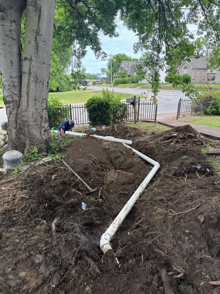 Open trench for a cast iron sewer line repair in The Nations
