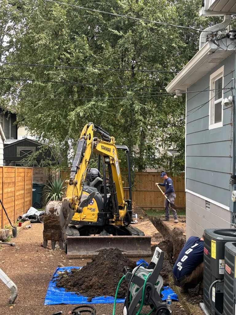 Excavator opening the ground for a PEX water line replacement in Old Hickory