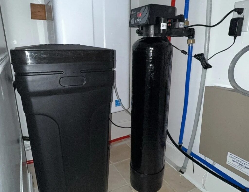 Salt-based water softener with brine tank installed by 100 Percent Plumbing in Nashville