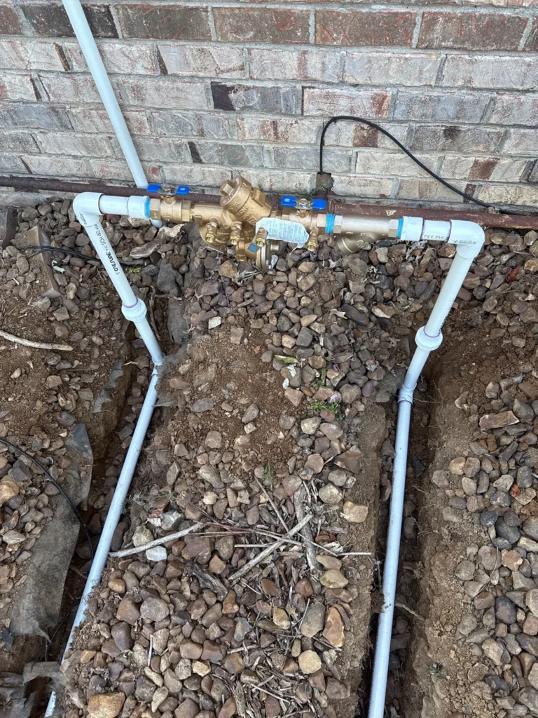 New irrigation backflow and supply line run in a Mount Juliet yard