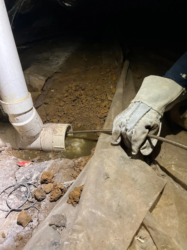 Drain machine set up at a floor cleanout on a drain cleaning job in Brentwood