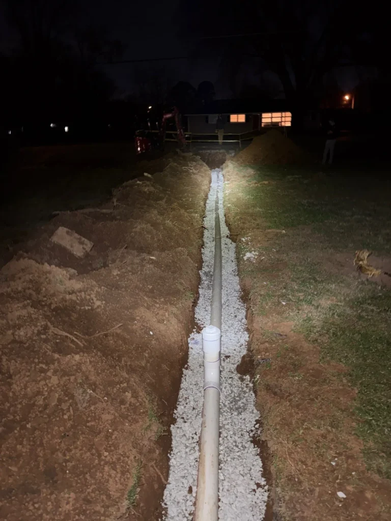 New sewer line laid the length of an open trench in Smyrna