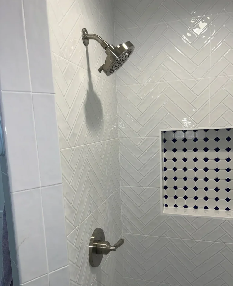 New shower valve and trim installed in a tiled Sylvan Park bathroom