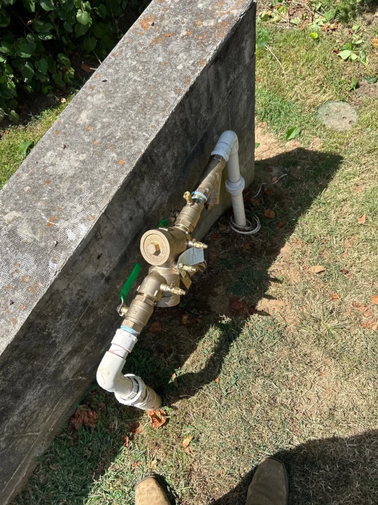 Replacement backflow assembly set outside a Brentwood home